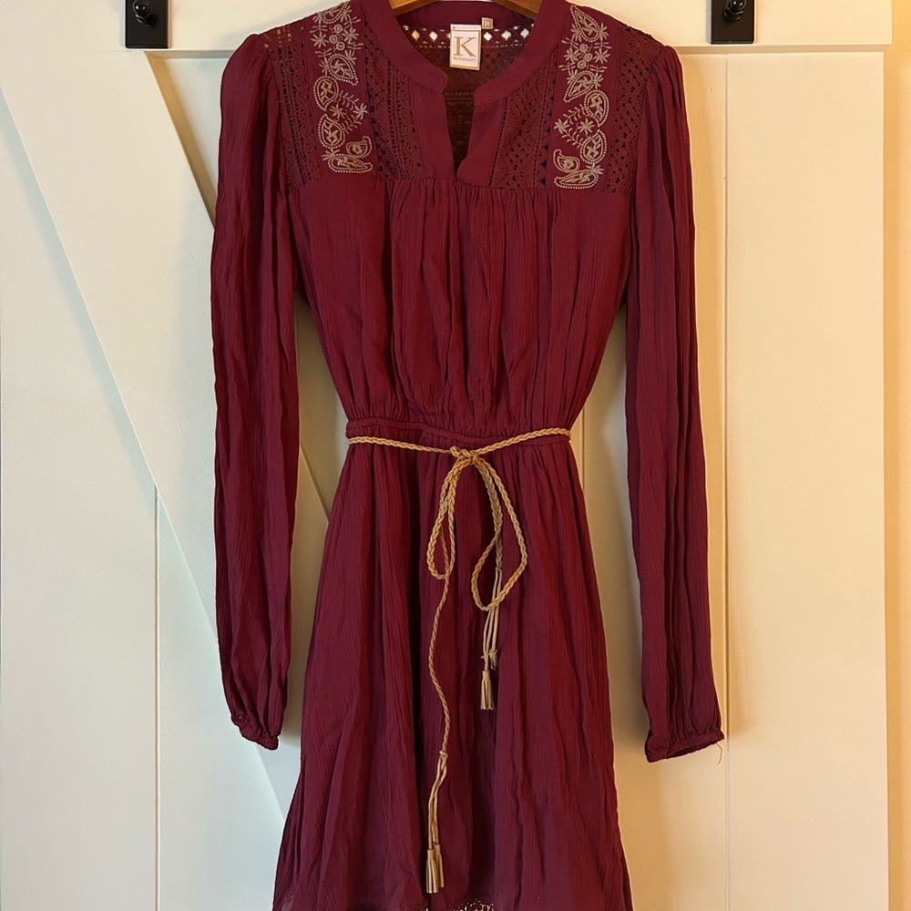 Kinnucan’s belted crimson dress